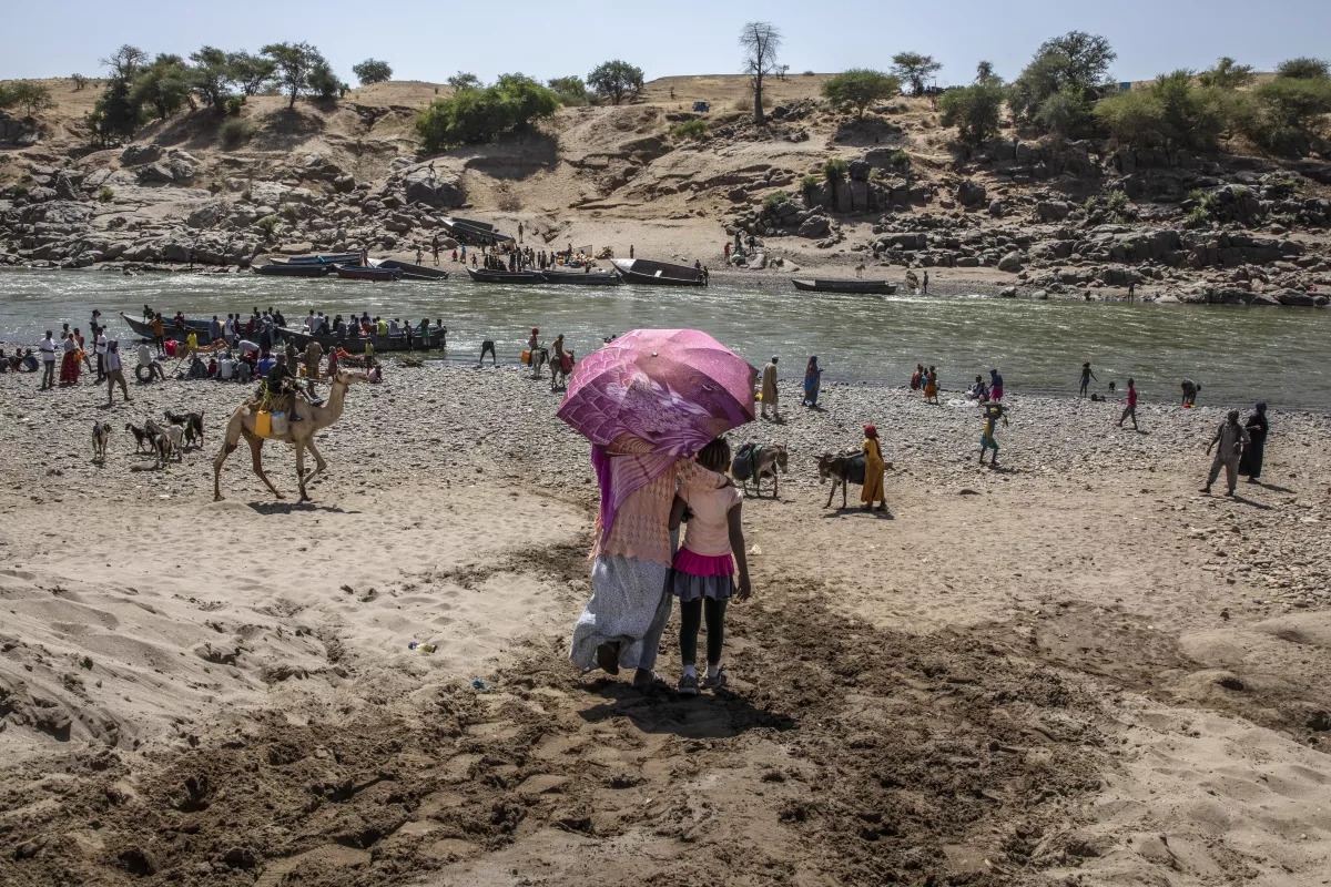 Refugees who fled the conflict on the banks of the Tekeze River on the Sudan-Ethiopia border